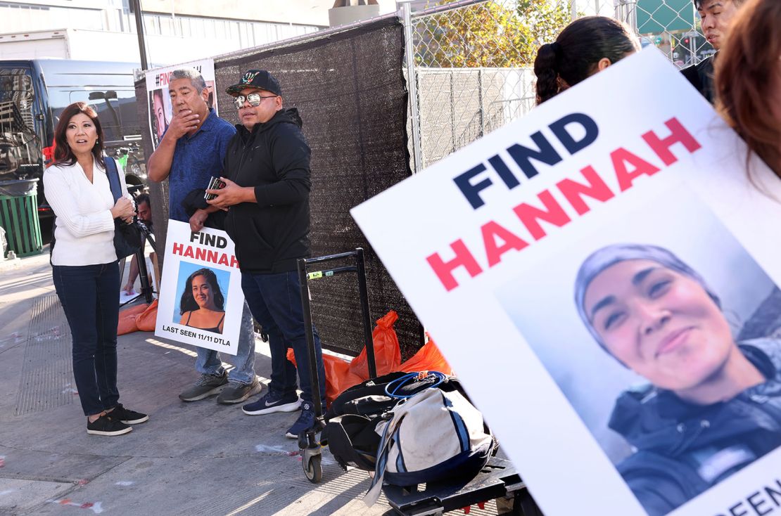 Volunteers hung fliers from missing Maui woman Hannah Kobayashi outside the Crypto.com Arena in downtown Los Angeles.